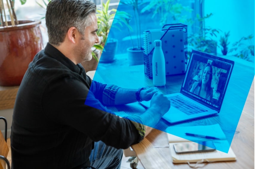 Man speaking to woman during virtual job interview.
